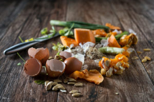 Organic leftovers, waste from vegetable ready for recycling and to compost. Collecting food leftovers for composting. Environmentally responsible behavior, ecology concept.