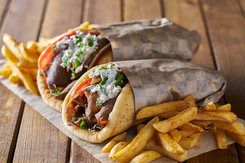 tasty greek gyros with fries with feta cheese and tzattziki sauce - get greek, italian, seafood, sushi, thia and modern australian food delivered in the sutherland shire