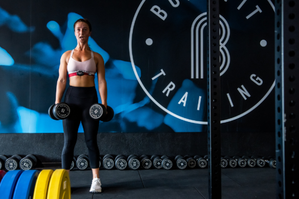 Body Fit Training room with woman lifting weights