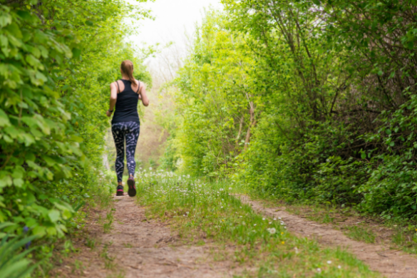 woman jogging through bush