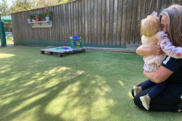 childrens serviceschildcare worker hugging child